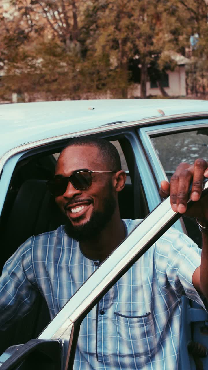 A smiling car owner at the driver's door