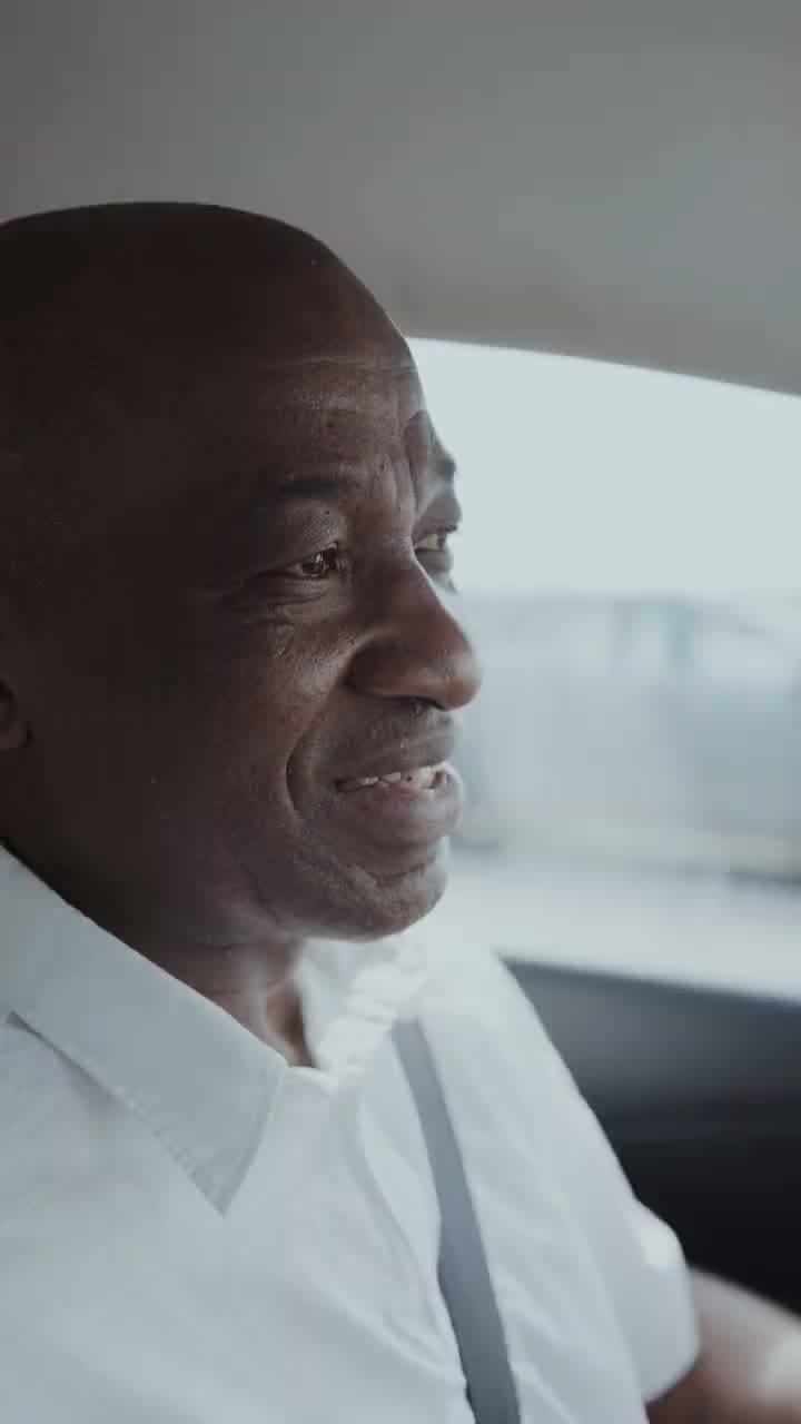 A smiling driver behind the wheel